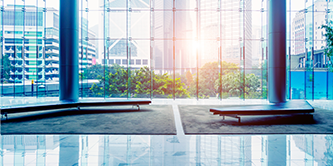 bright office foyer with a wall of windows

