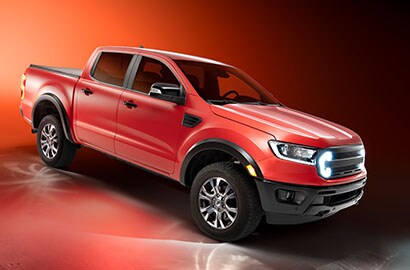 Red SUV on red studio background
