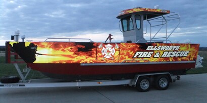A boat covered in a firey ellsworth graphic using 3M™ Scotchlite™ Removable Reflective 680CR

