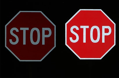 A stop sign with white text