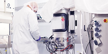 person working on bioprocessing unit
