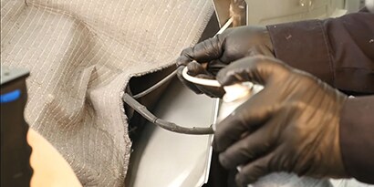 cavity wax applied inside auto body frame member
