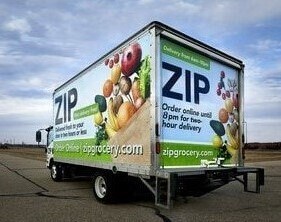 ZIP delivery truck with large 3M graphic wrap on the trailer.
