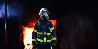 A firefighter in firefighter personal protective equipment
