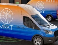 Blue MRKT vehicle with full 3M graphic wrap.
