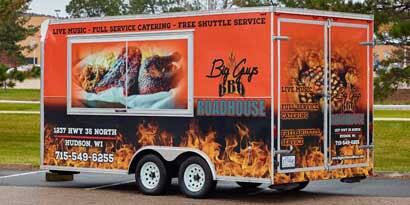 Trailer wrapped in a fiery BBQ graphic using 3M reflective film.
