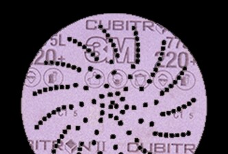 3M Xtract™ Cubitron™ II film disc 775L on black background
