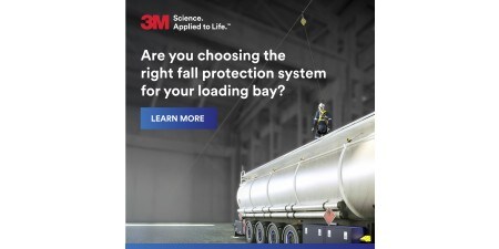 Front cover of a brochure showing of a worker wearing fall protection gear standing on top of a large tanker truck inside an industrial facility. 
