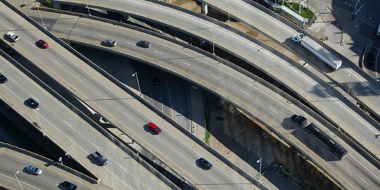 An aerial view of busy highways in the morning. 
