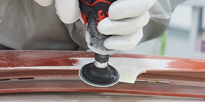 grinding bumper tab prior to repair
