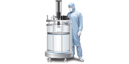 Technician standing next to a chromatography column
