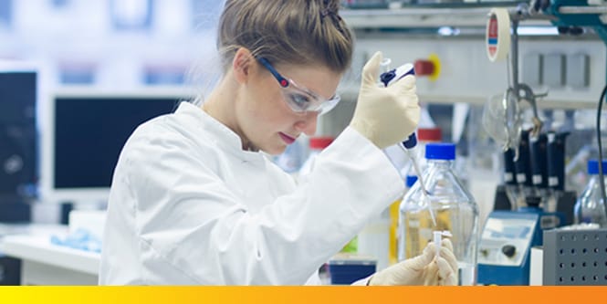 Female scientist using a pipette to move liquid
