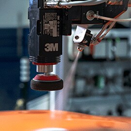 Close up of robotic arm of 3m™ Finesse-it™ Robotic Paint Repair System