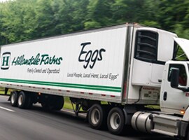 hillandale farms commercial truck driving down a highway