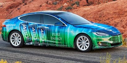 A sedan on a black top road in the desert, wrapped in a blue shift to green SV480 3M envision print wrap film.
